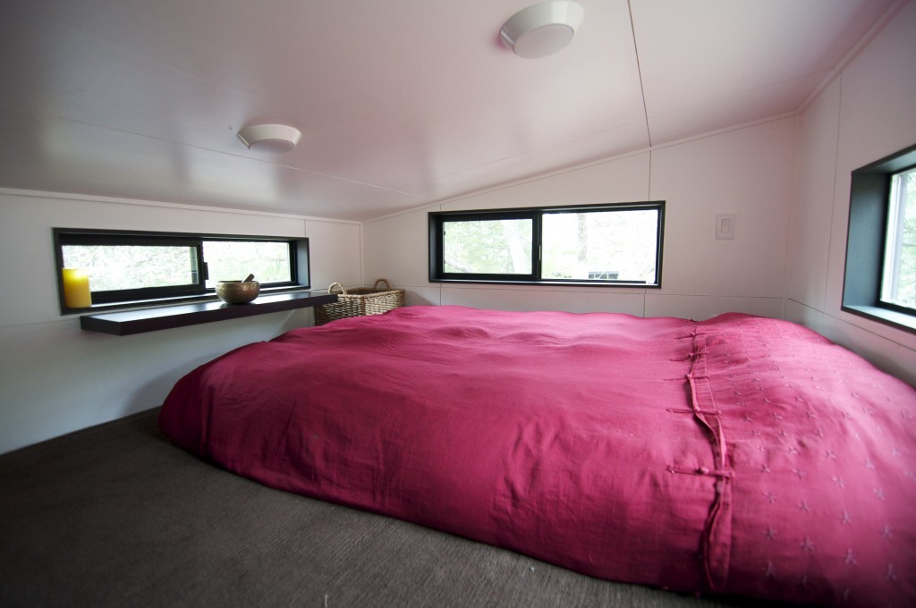 sleeping loft with high windows